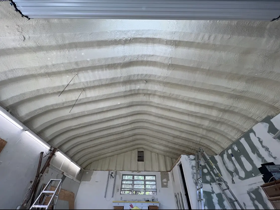 Spray polyurethane foam applied to the underside of a metal roof deck in Vincennes